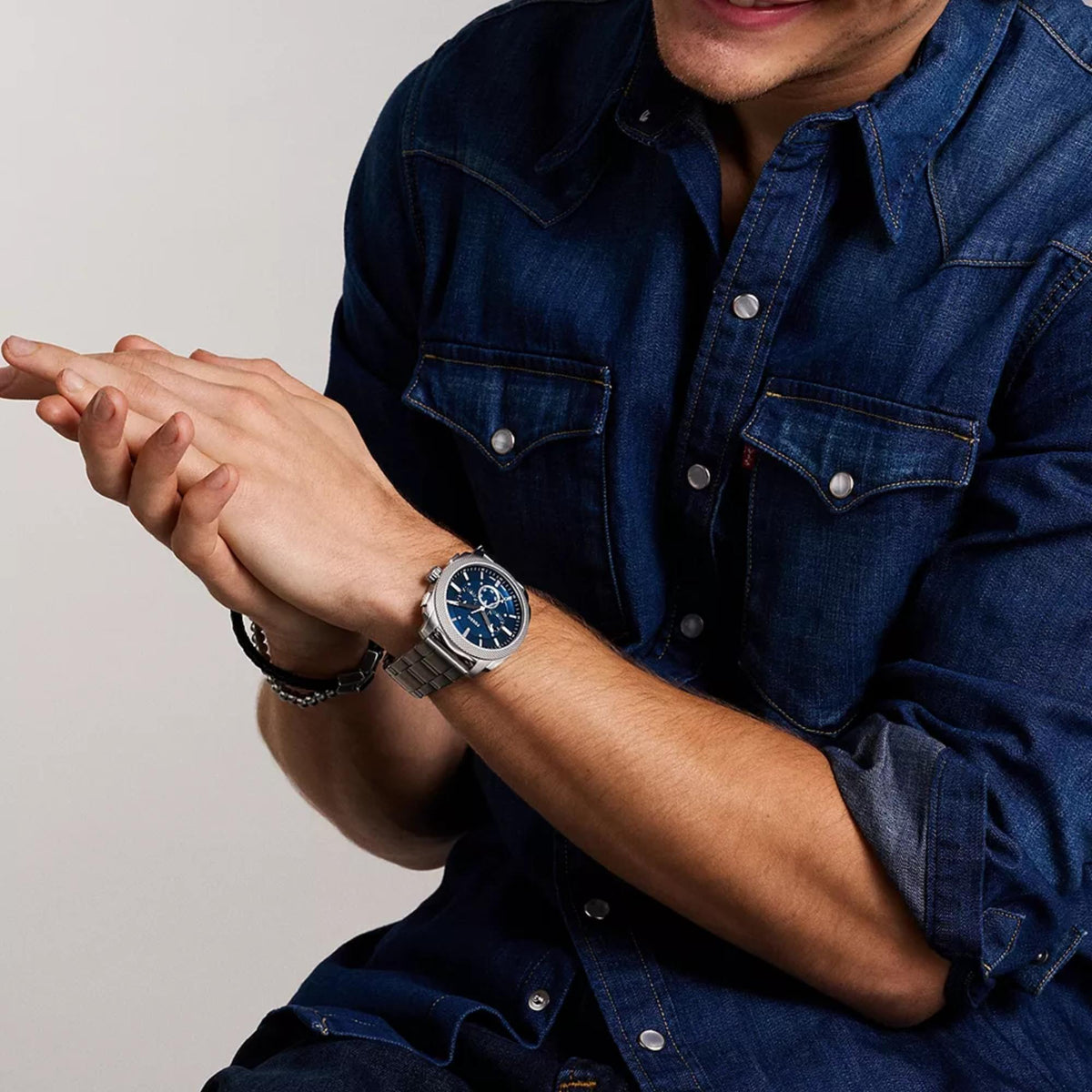 Fossil Machine FS6096 lifestyle view on wrist with denim shirt