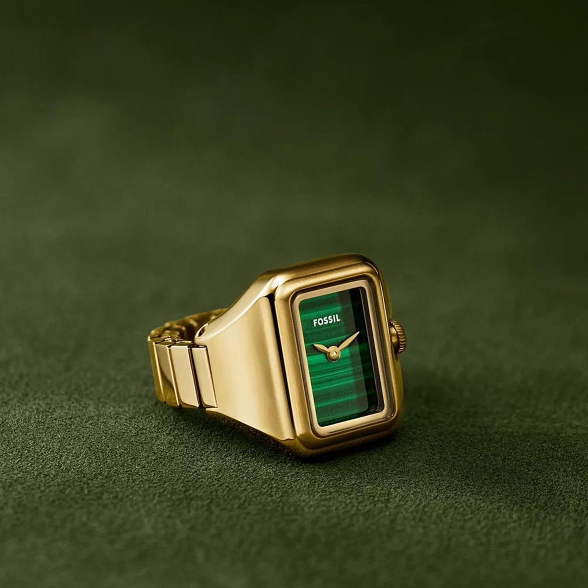 Fossil Raquel ES544 green dial steel ladies quartz ring watch studio product view on textured green surface