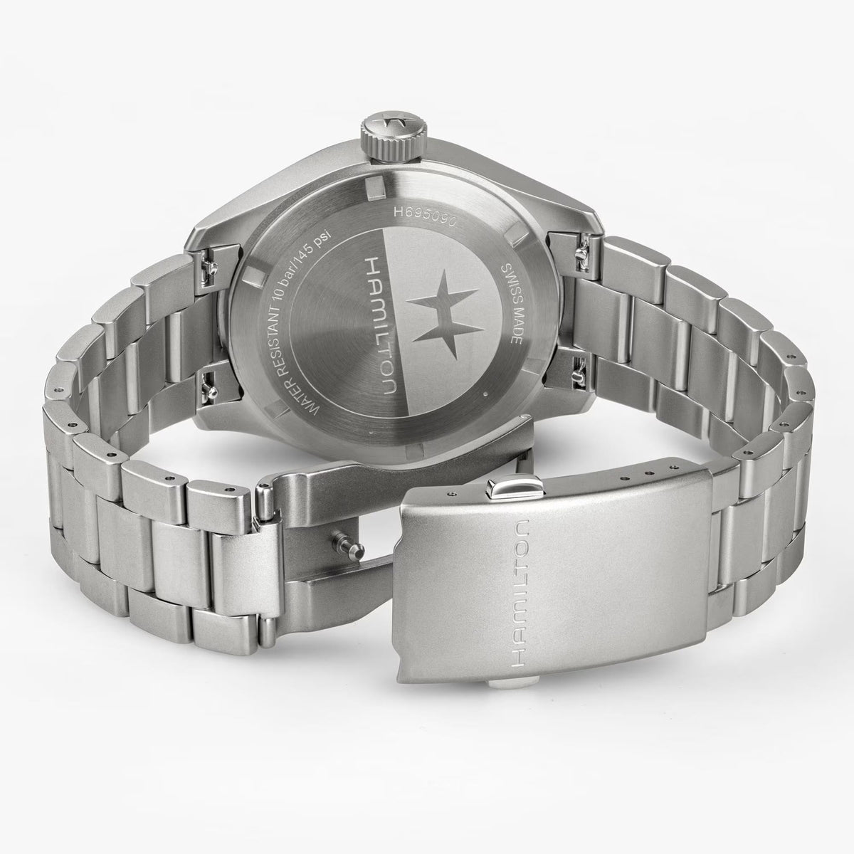 Back view of steel watch case with bracelet clasp and engraved markings