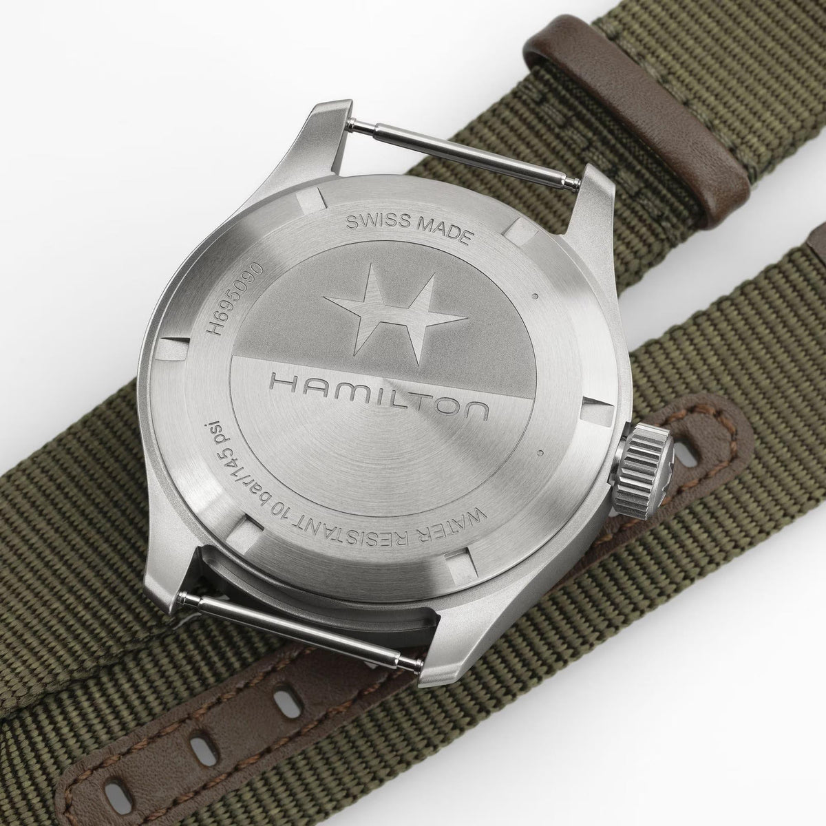 Men's field watch case back in stainless steel with Hamilton and Swiss Made text