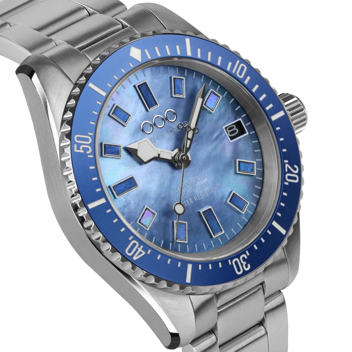 Men's automatic watch close-up: blue dial with geometric markers and steel case