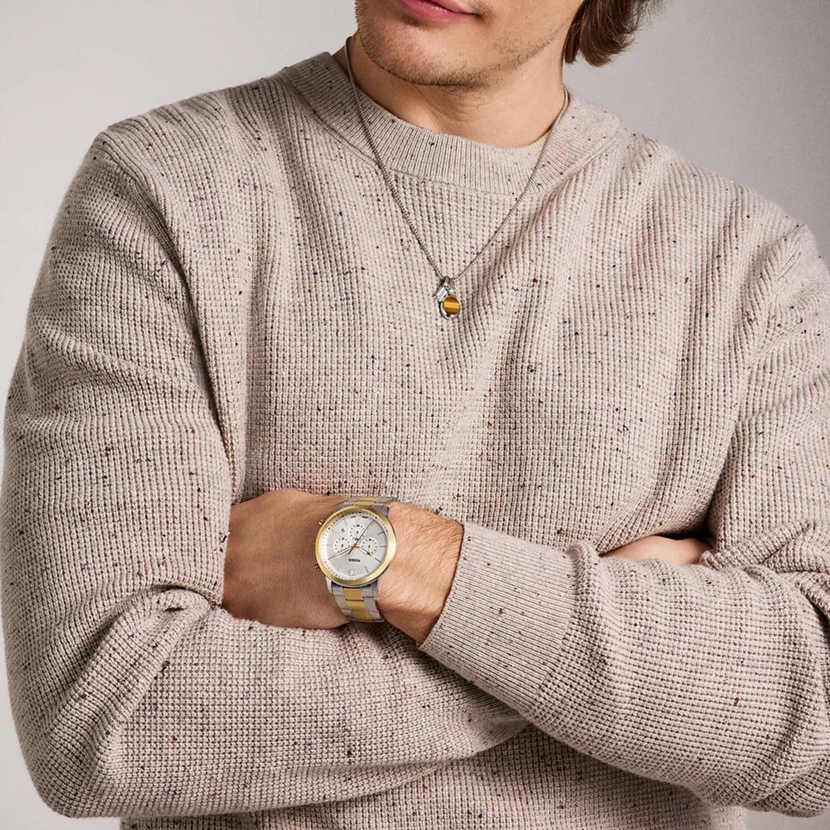 Fossil Neutra 44mm Chronograph FS6112 worn on a man's wrist with a casual knit sweater