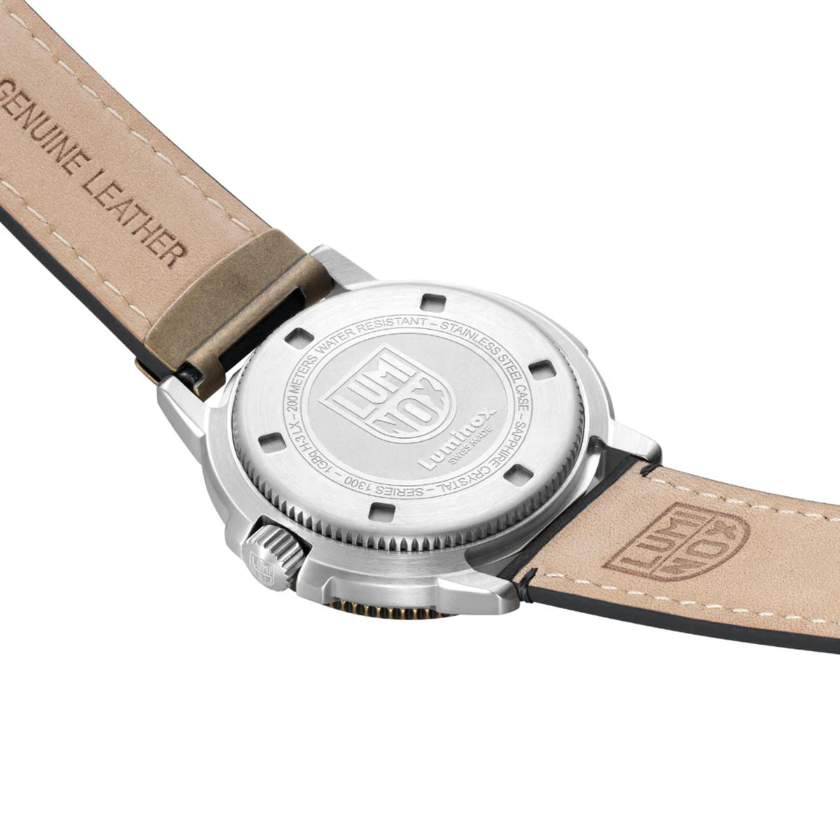 Angled view of engraved stainless steel caseback of the Luminox Adventure Watch XL.1301 and the light tan underside of its black leather strap