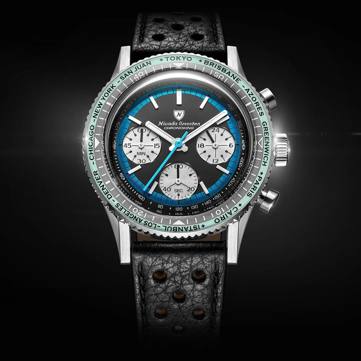 Nivada Grenchen Chronoking chronograph watch with a silver-tone case, leather strap, and a black dial featuring a vibrant blue sub-dial and a green world map bezel