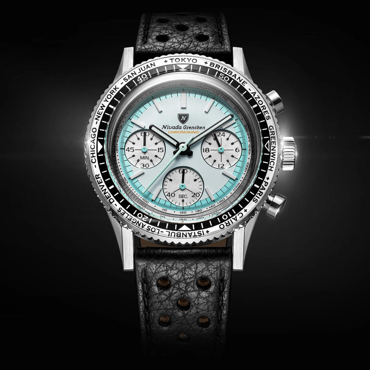 Nivada Grenchen Chronoking watch with a silver-toned case, black textured leather strap, and a white dial.