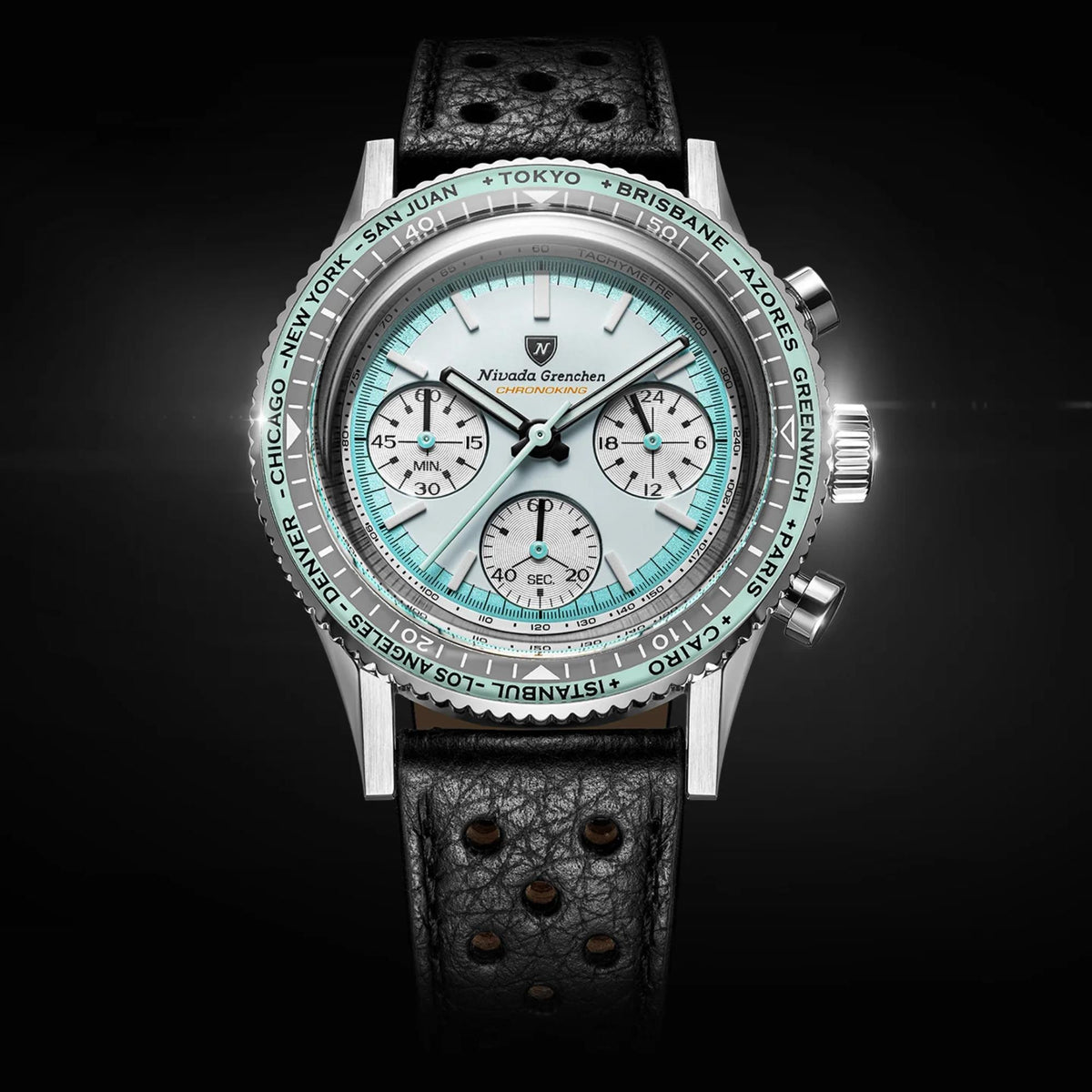 Nivada Grenchen Chronoking watch with a stainless steel case, a white dial, and a black textured leather strap, set against a dark background