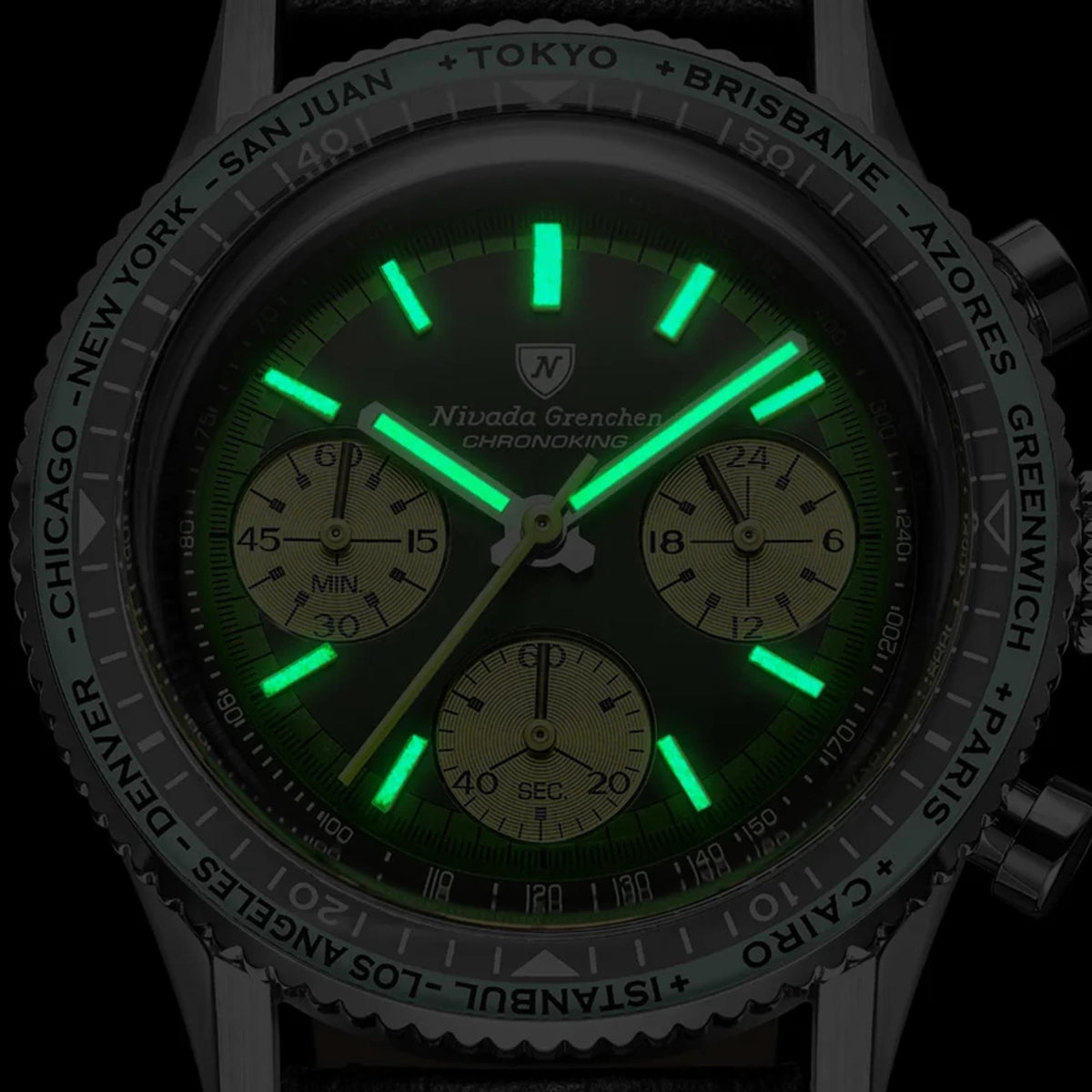 Close-up shot showcasing the bright green luminous watch hands and hour markers' glow-in-the-dark feature on the Nivada Grenchen Chronoking