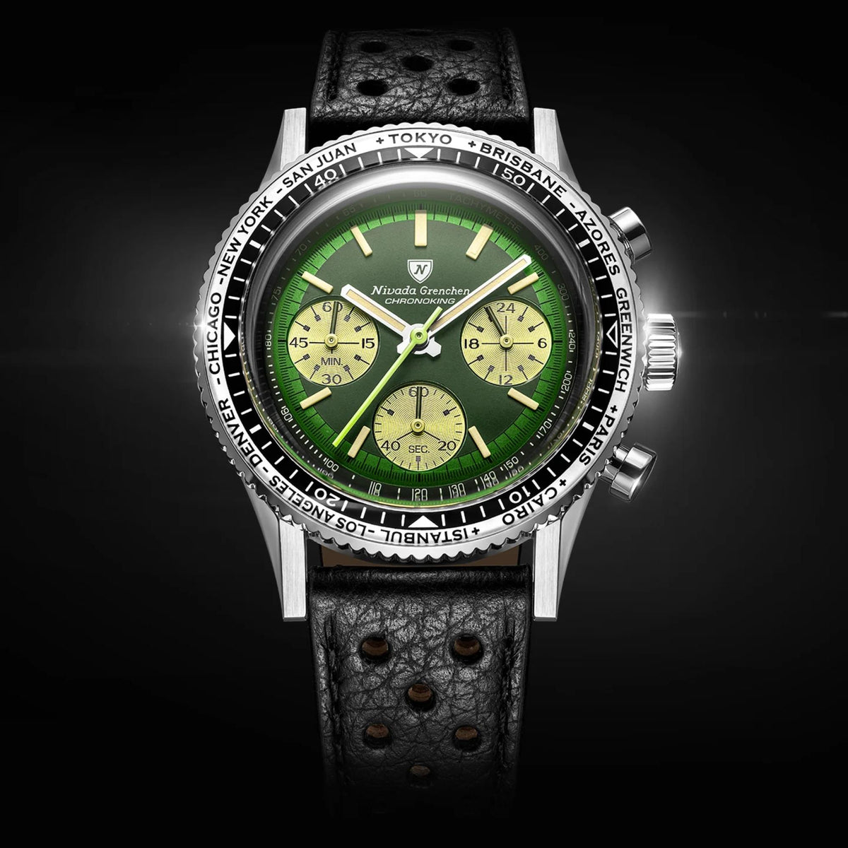 Nivada Grenchen Chronoking watch with a green dial, black leather racing strap, and a black-and-silver world-time city bezel against a black background