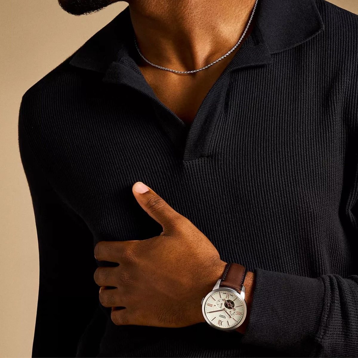 On-wrist perspective of the Fossil Townsman ME3266 wrist watch highlighting the cream dial with rose gold-tone indices and brown leather strap.