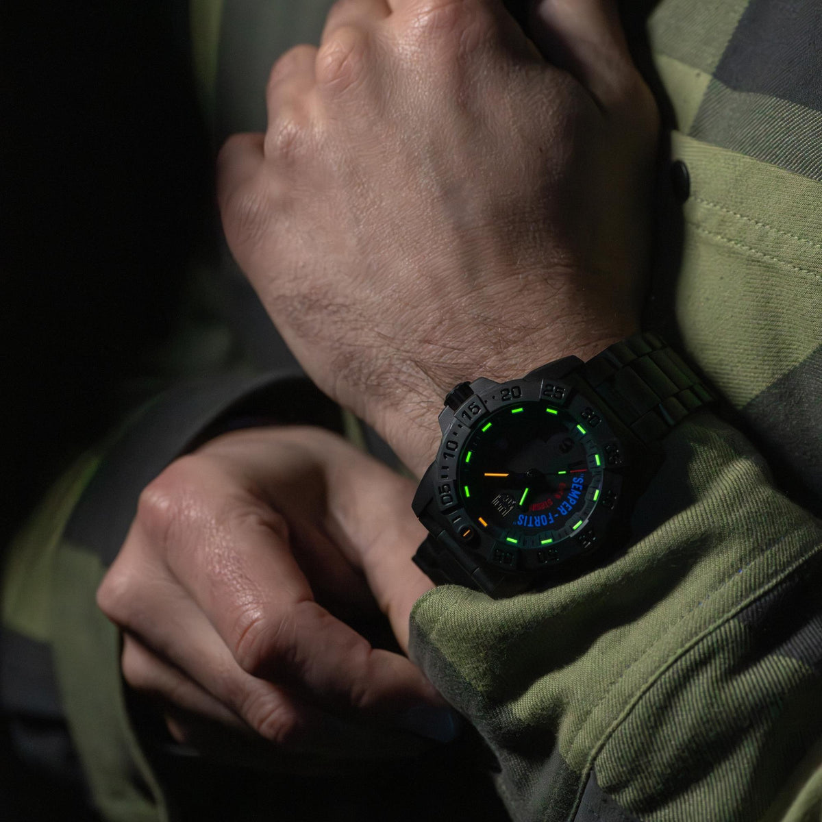 Luminox Navy SEAL XS.3515.N wrist shot showcasing glowing tritium night vision tubes on black dial