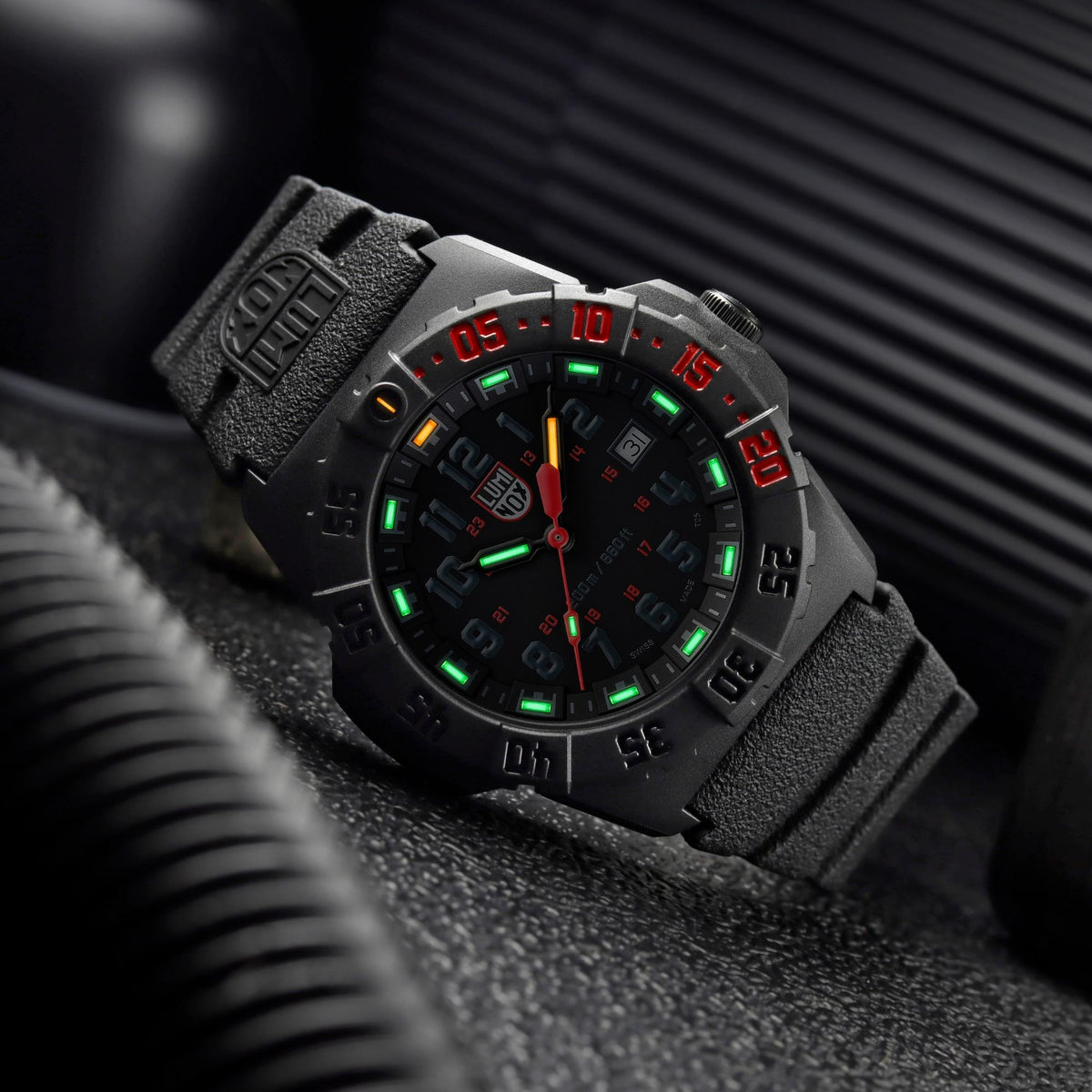 Luminox Navy SEAL 3550 Series XS.3565 angled view showing illuminated tritium tubes on black dial and bezel markings