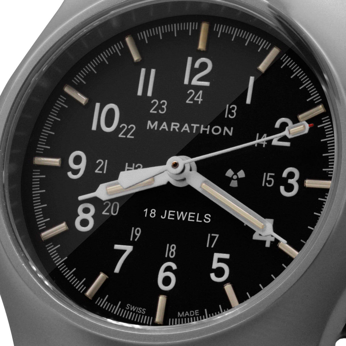 Close up of Marathon General Purpose Mechanical WW194003SS-0108 mens timepiece displaying black dial, tritium illumination tubes, and 18 jewels text