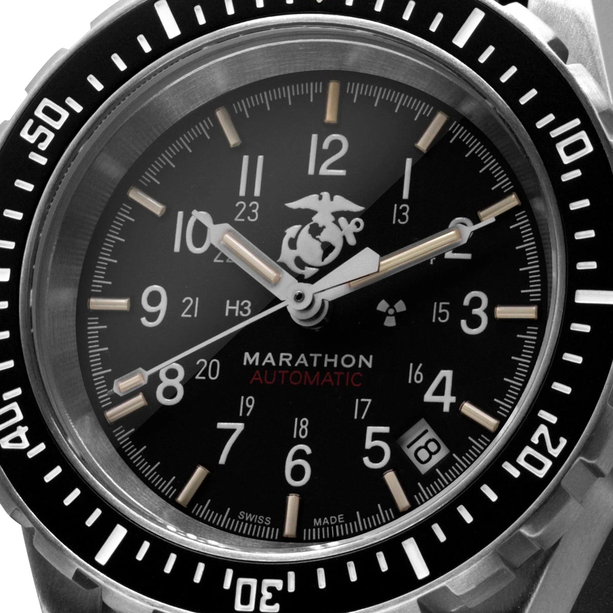 Marathon GSAR Official USMC WW194006SS-0208 mens automatic watch featuring a detailed black dial, 12- and 24-hour scales, a date display and the Official USMC™ emblem beneath 12 o’clock