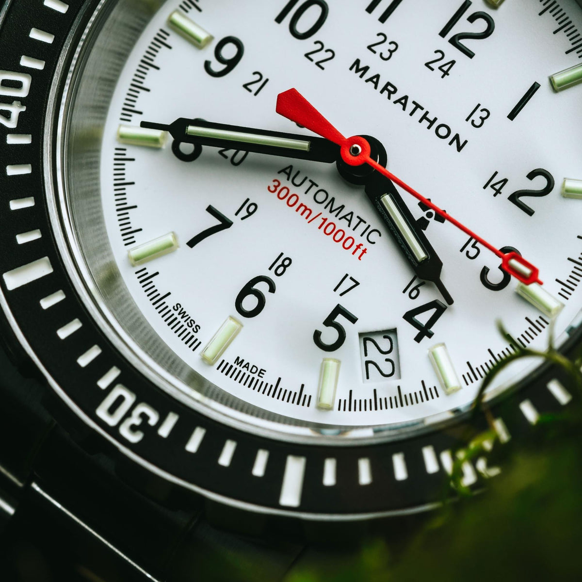 Marathon GSAR Arctic Edition WW194006SS-0513 automatic timepiece detailed view showing red second hand and white dial markings