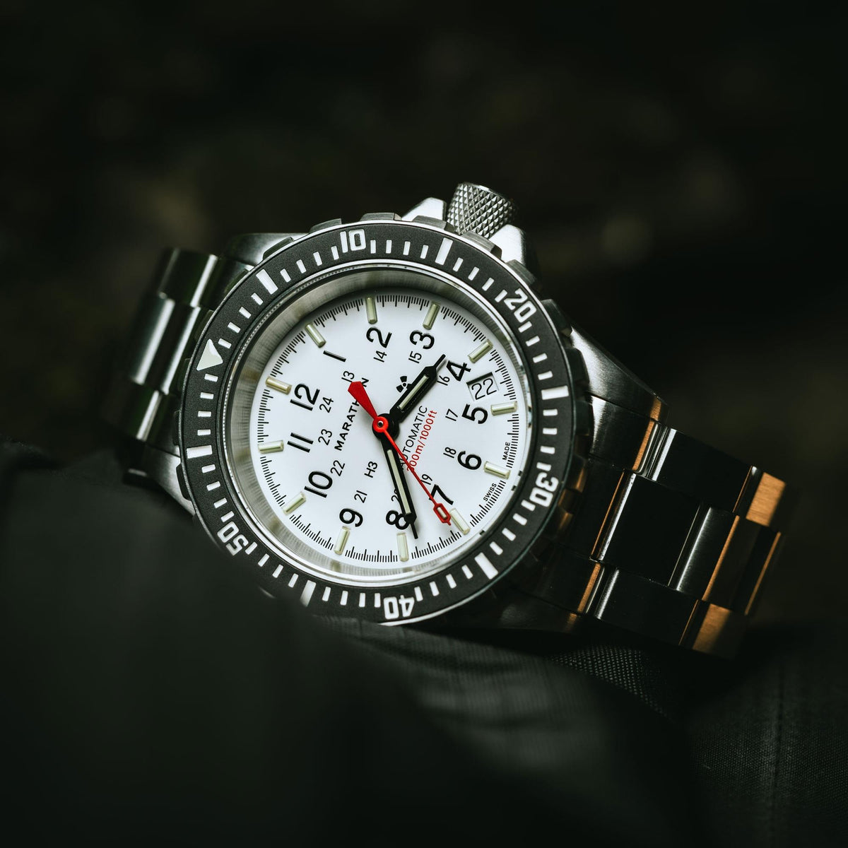 Marathon GSAR Arctic Edition WW194006SS-0513 mens automatic watch angled on a dark background with white dial visible