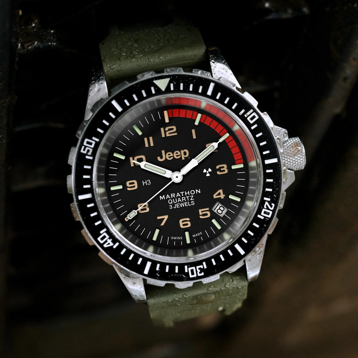 Marathon Jeep® Rubicon TSAR® WW194007SS-4101 mens quartz timepiece resting on a dark surface with water droplets