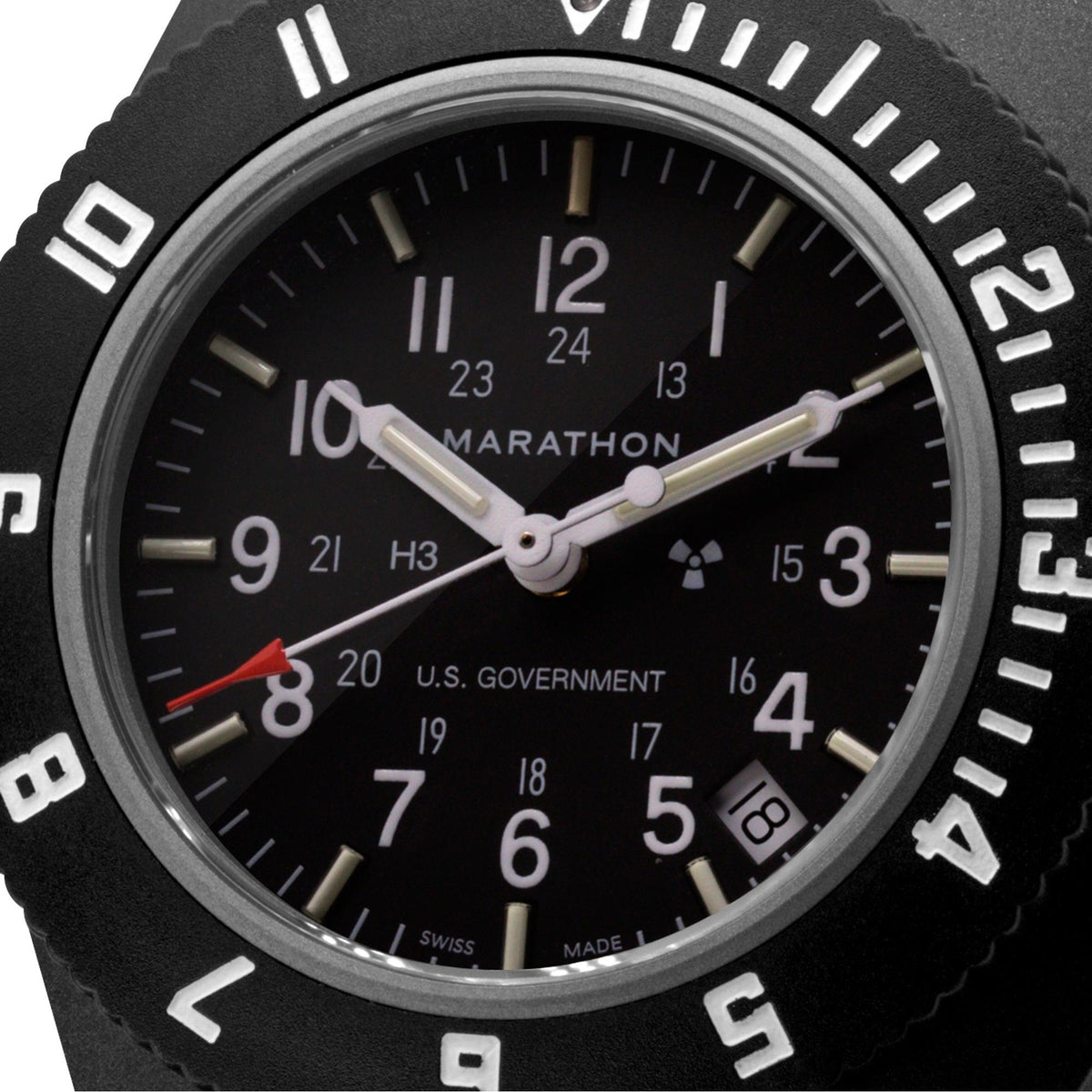 Marathon Navigator WW194013BK-0001 watch macro shot highlighting black dial markings and hands