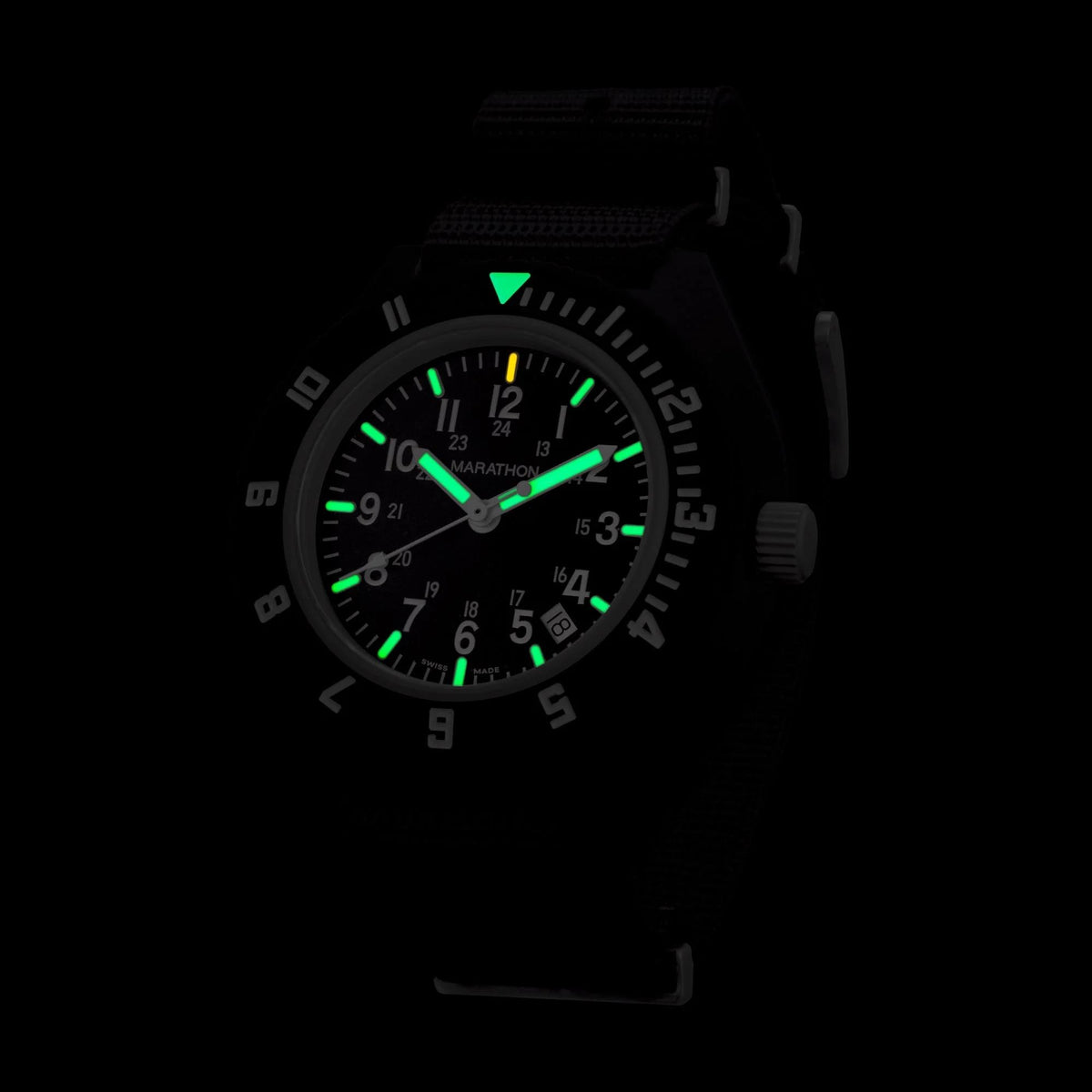 Marathon Navigator WW194013BK-2102 quartz watch displaying glowing MaraGlo luminescent markers in dark conditions