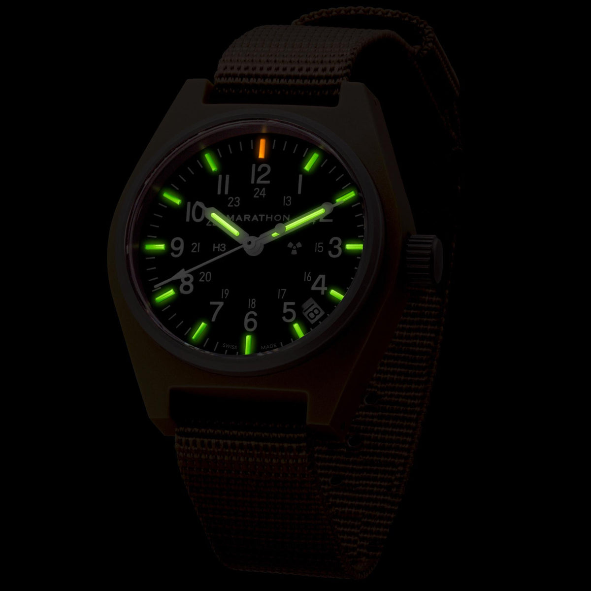 Marathon General Purpose Field WW194015DT-0103 quartz watch displaying illuminated tritium gas tubes on dial in dark conditions