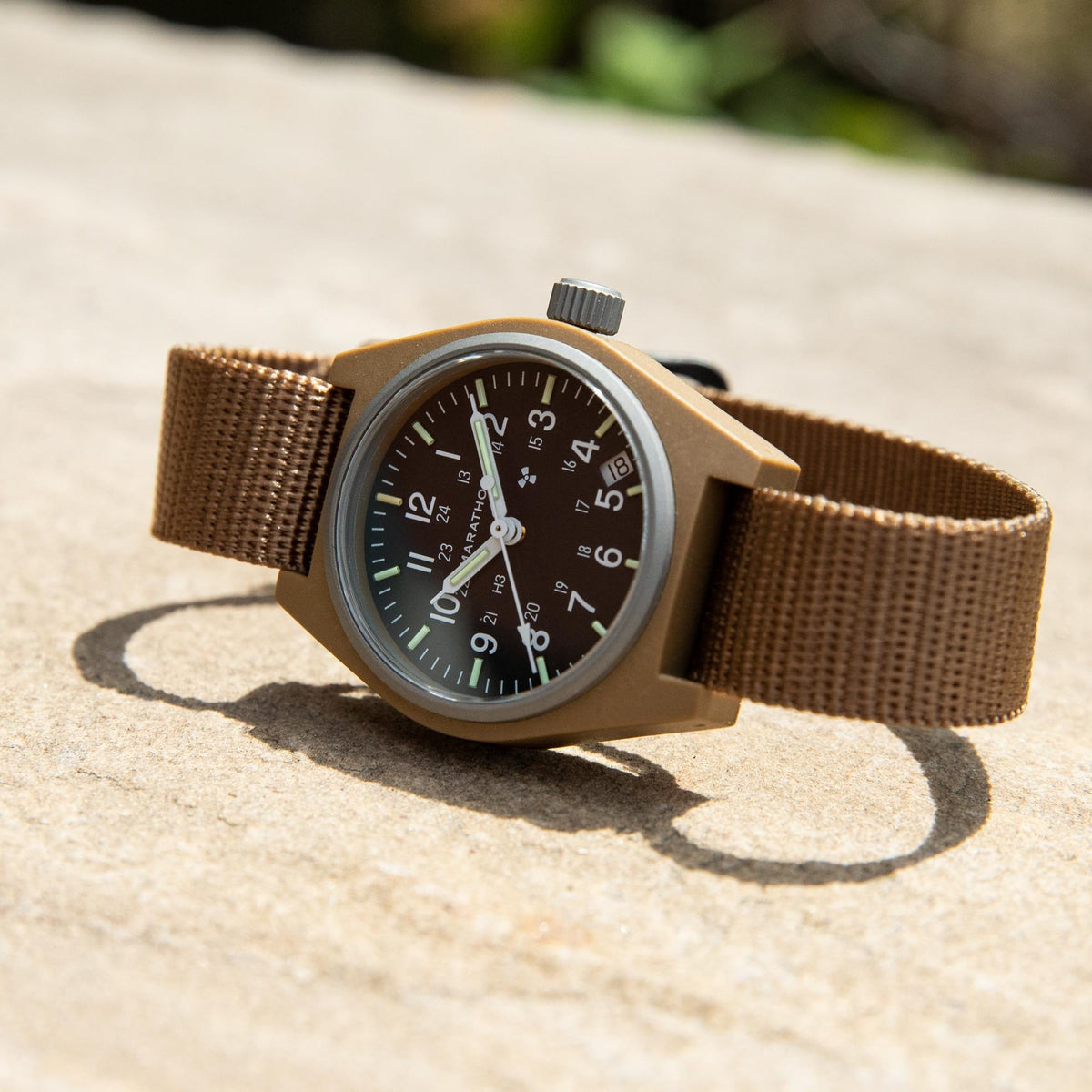 Marathon General Purpose Field WW194015DT-0103 mens quartz watch resting flat on a light stone surface