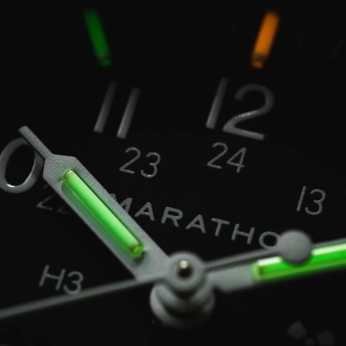Marathon Officer's Quartz WW194015SS-0108 quartz watch displaying illuminated tritium gas tubes on hands and indices in darkness
