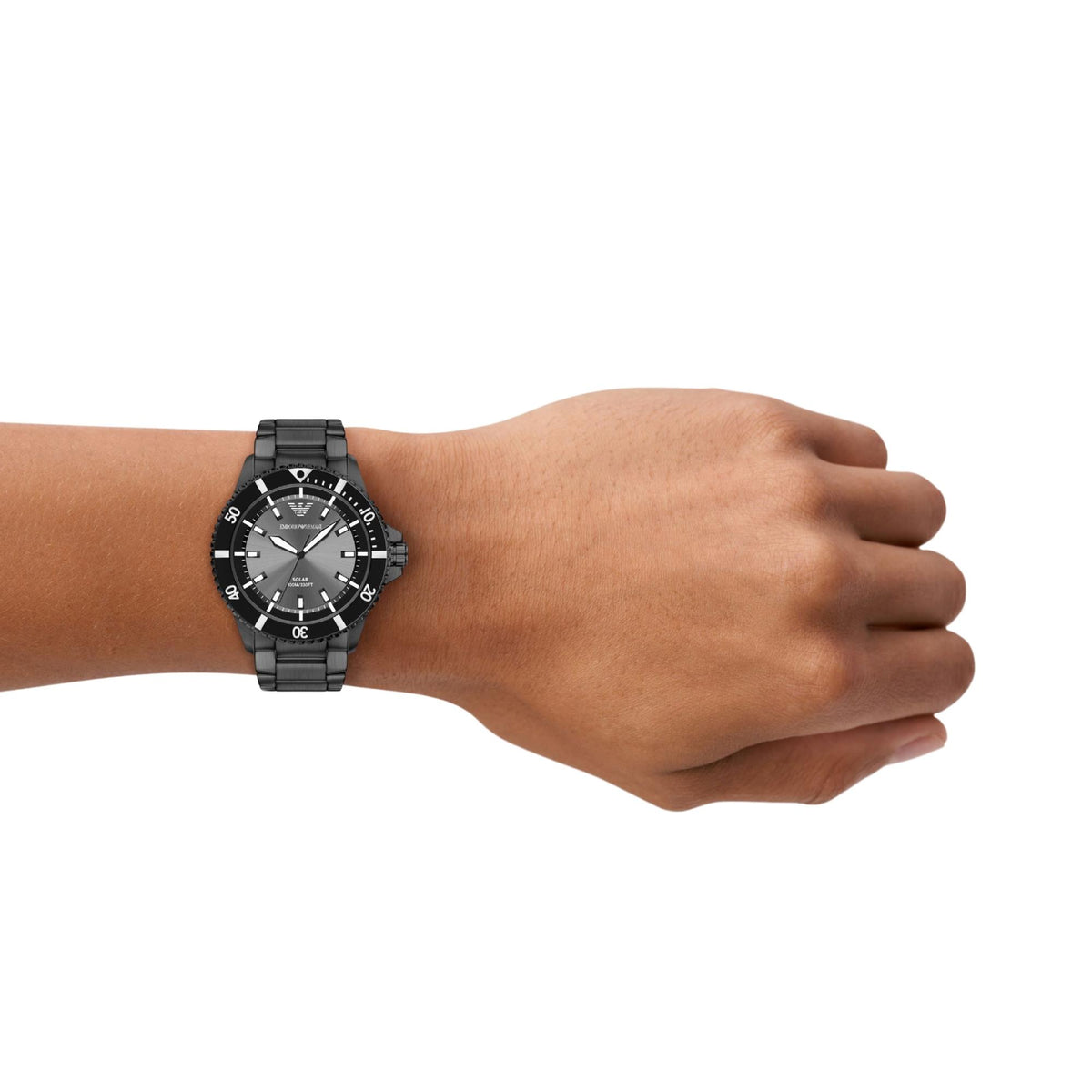 Emporio Armani World Explorer AR11831 timepiece worn on a wrist, displaying the 42mm grey dial, black rotating bezel, and dark grey steel link bracelet