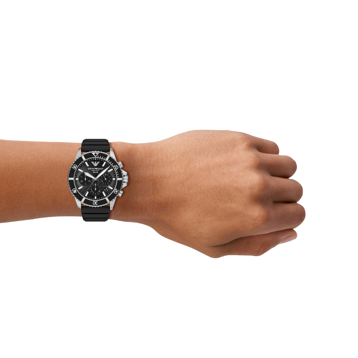 Emporio Armani World Explorer AR11830 timepiece worn on a wrist, displaying the 43mm black dial, rotating dive bezel, side pushers, and flexible black rubber strap