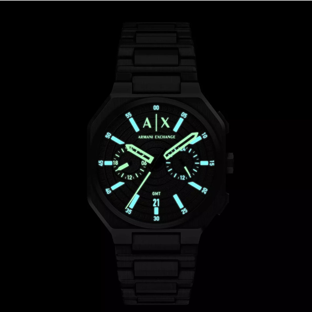 Armani Exchange Bass AX1478 illuminated dial view highlighting luminous hands and markers in dark lighting