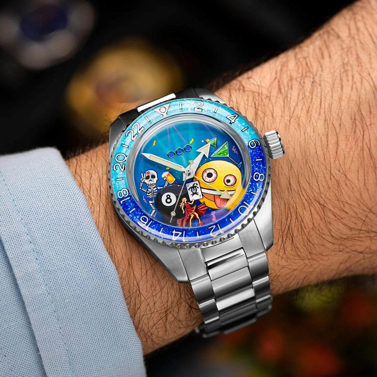 Top-down wrist shot of the Out of Order x IFL Watches Shaker Happy Hour OOO.001-25.HH.BAND.SS watch highlighting the 40mm steel case fit and blue bezel ring