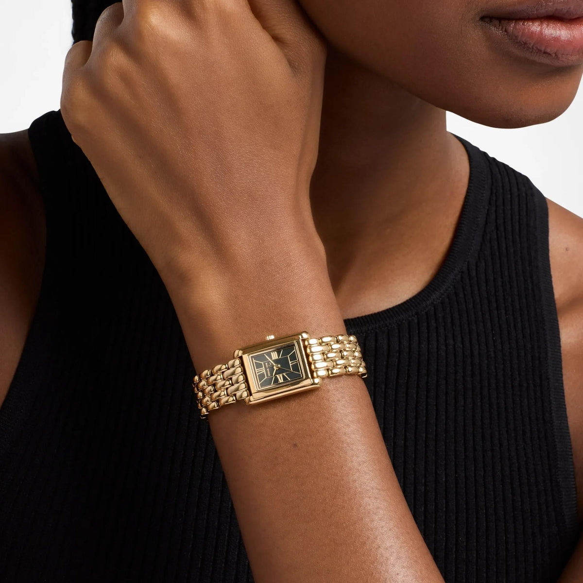 Michael Kors Essex 24mm MK7632 women's quartz watch model shot view displaying the rectangular gold-tone wristwatch with a green dial on the wrist