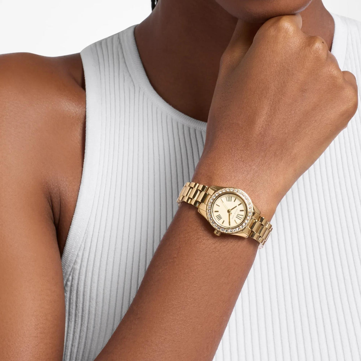 Michael Kors Lexington Gold Dial MK7659SET women's watch model shot view showing the crystal-embellished gold-tone watch worn on the wrist