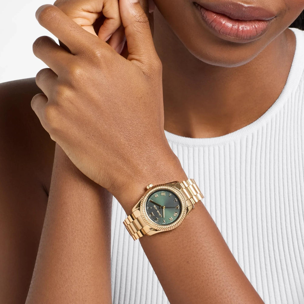 Michael Kors Lexington Pavé 33mm Green Dial MK7622 ladies quartz watch model shot view showing the gold-tone crystal-embellished timepiece worn on the wrist
