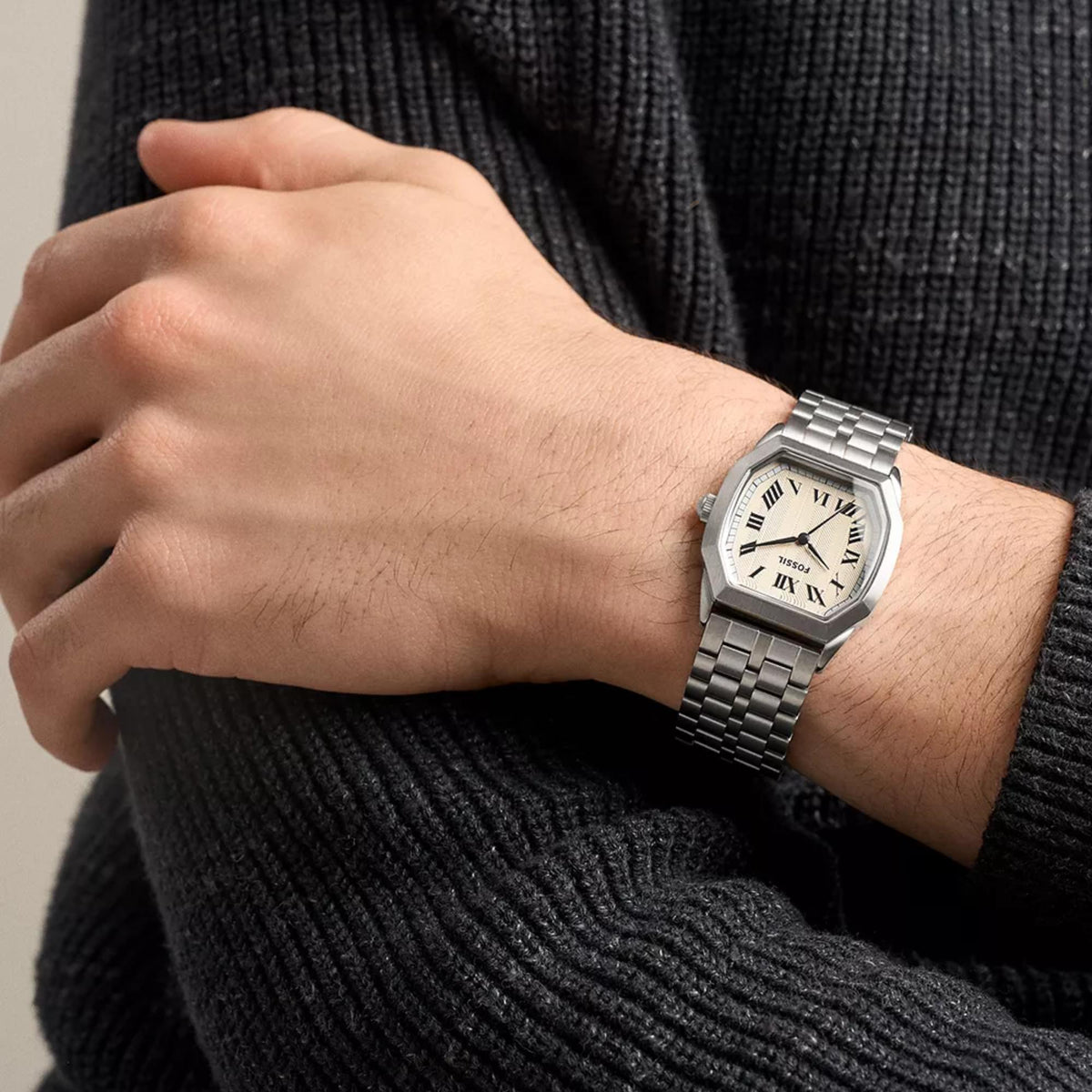 On-wrist view of the Fossil Harlow FS6211 quartz watch showcasing the textured cream dial and steel link strap