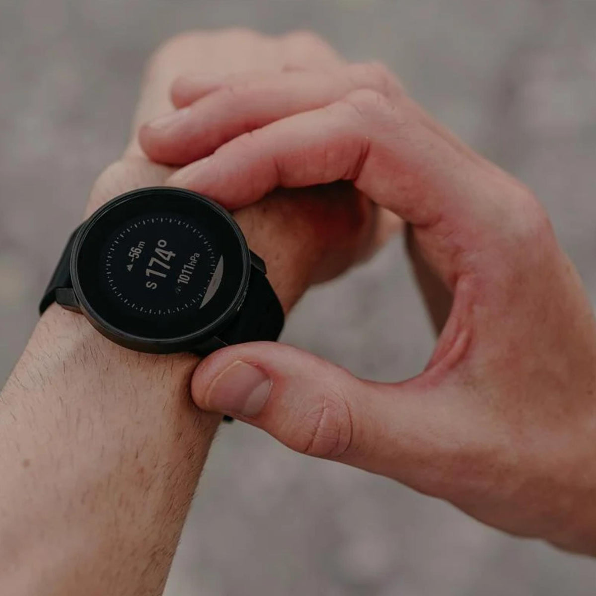 Suunto 9 Peak Pro SS050807000 close-up view worn on wrist displaying compass screen interface