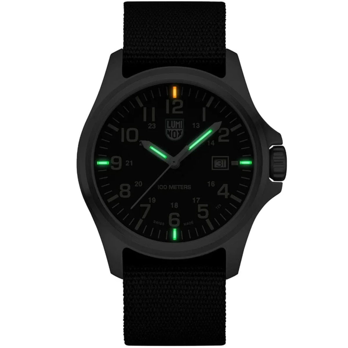 The Luminox G-Collection 'Moon Valley' 2500 Series X2.2517 watch glowing in the dark, with distinct orange and green luminous hour markers on the black dial