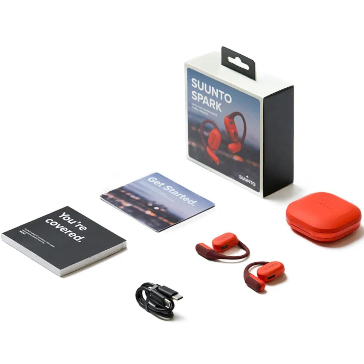 Suunto Spark Open-Ear SS051357000 full product set display featuring packaging box, charging case, cable, and booklets