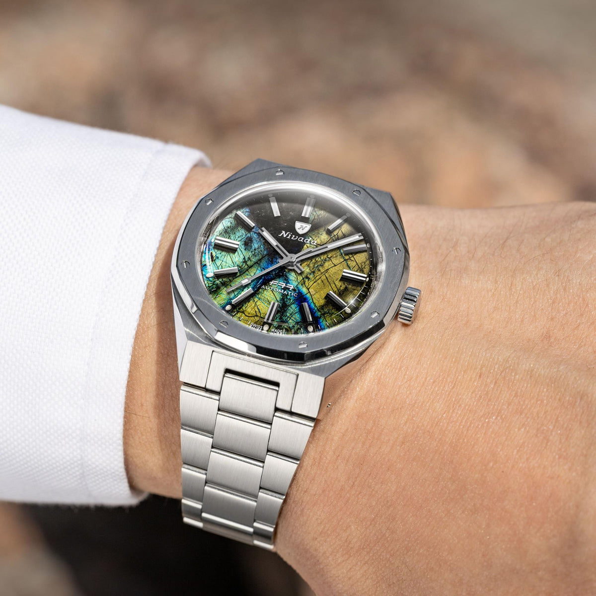 Nivada Grenchen F77 68054A77 lifestyle wrist shot displaying watch head with integrated steel bracelet links