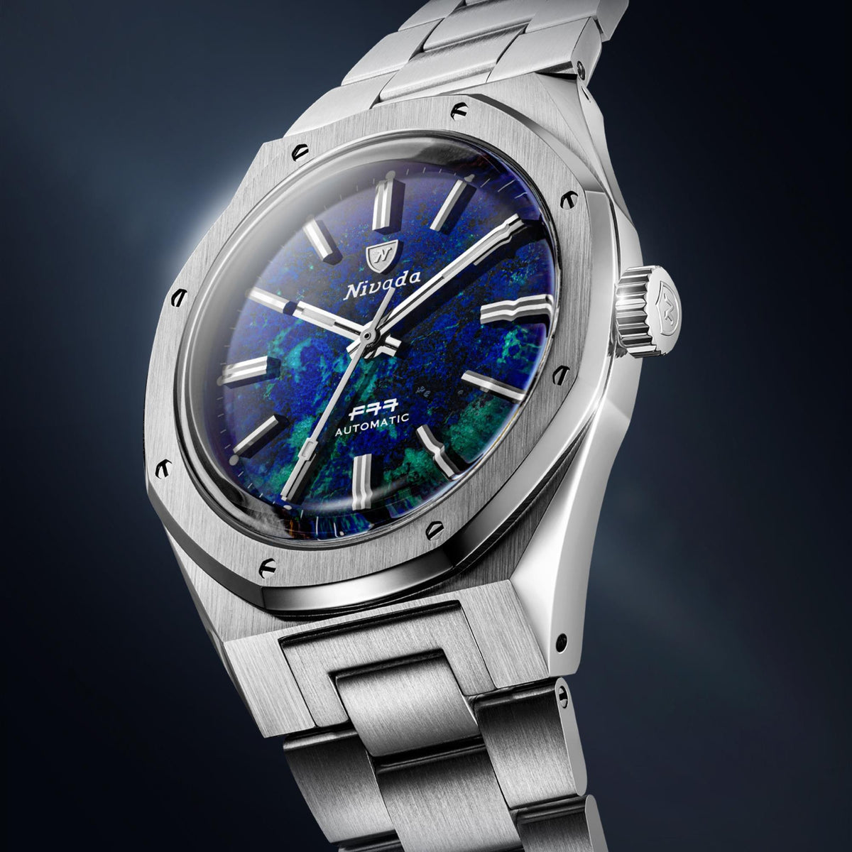 Nivada Grenchen F77 68056A77 close-up perspective showing steel bezel architecture and azurite dial texture