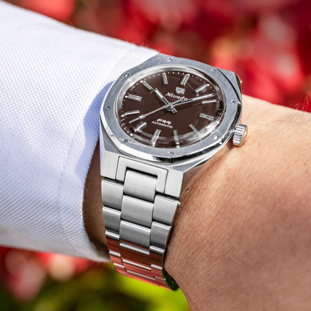 Nivada Grenchen F77 MK2 68060A77 wrist shot display of 38mm steel automatic watch outdoors