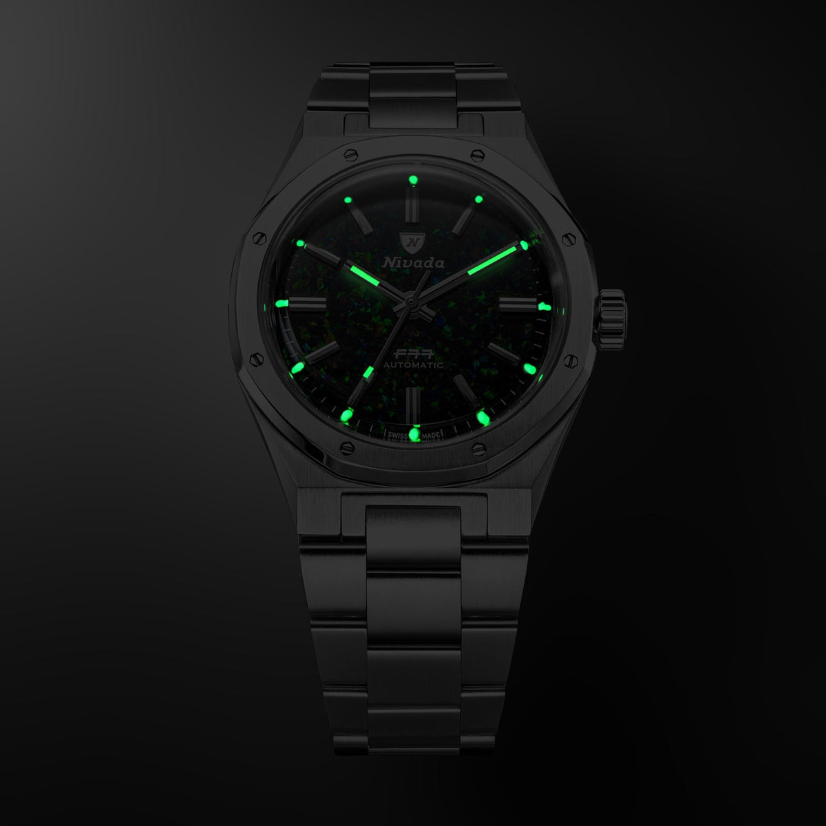 Nivada Grenchen F77 MK2 68062A77 dark view displaying glowing luminous hands and index markers