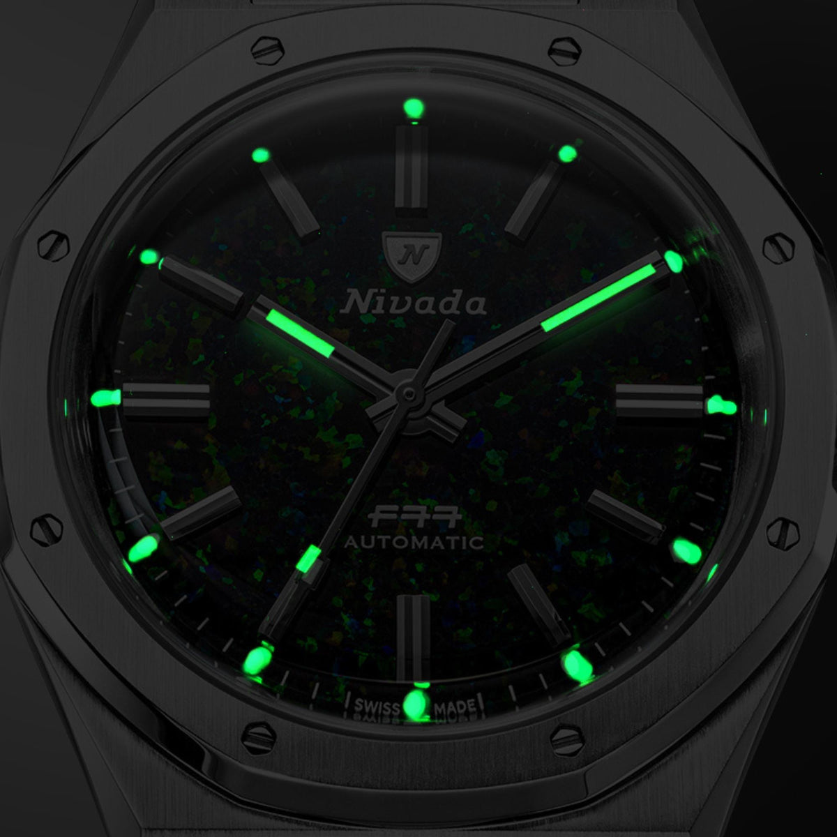 Nivada Grenchen F77 MK2 68062A77-DR dark view displaying glowing luminous hands and index markers