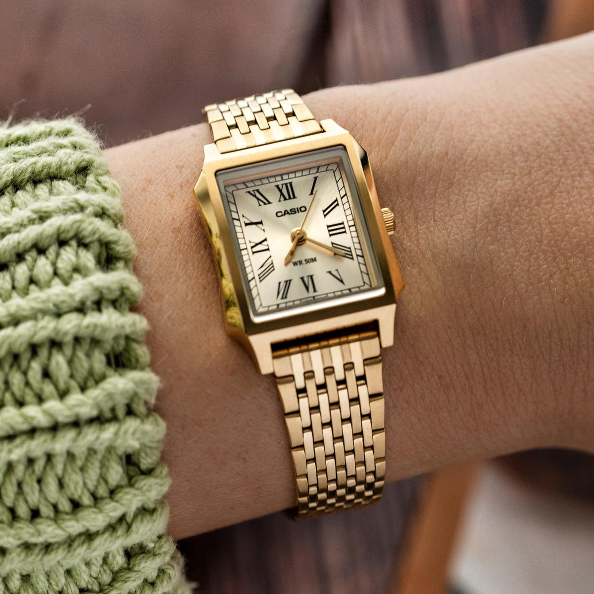 Casio Timeless LTP-B190G-9BVER wrist shot displaying gold dial on wrist with multi-link steel strap