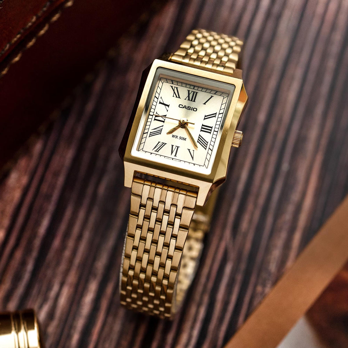 Casio Timeless LTP-B190G-9BVER angled view featuring gold dial display with stainless steel case profile