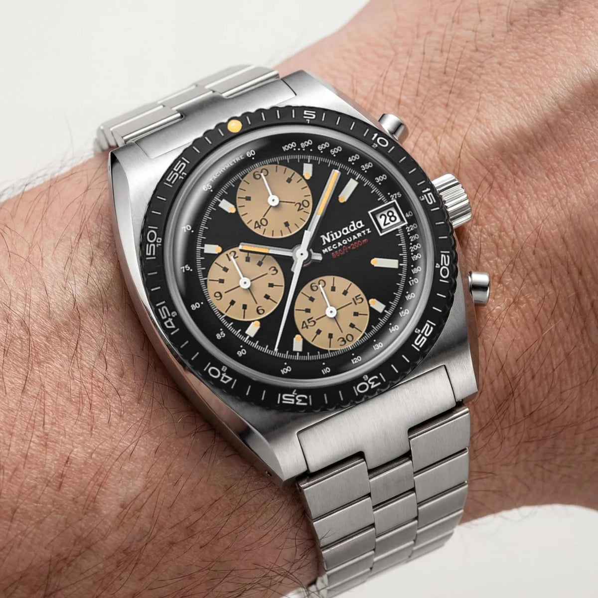 Nivada Grenchen Autochron NZ45PB1 wrist shot showcasing chronograph timepiece with silver steel bracelet profile