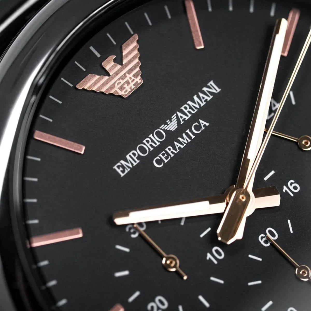 Emporio Armani Luigi AR1509 extreme close-up view displaying black dial texture and brand logo detail