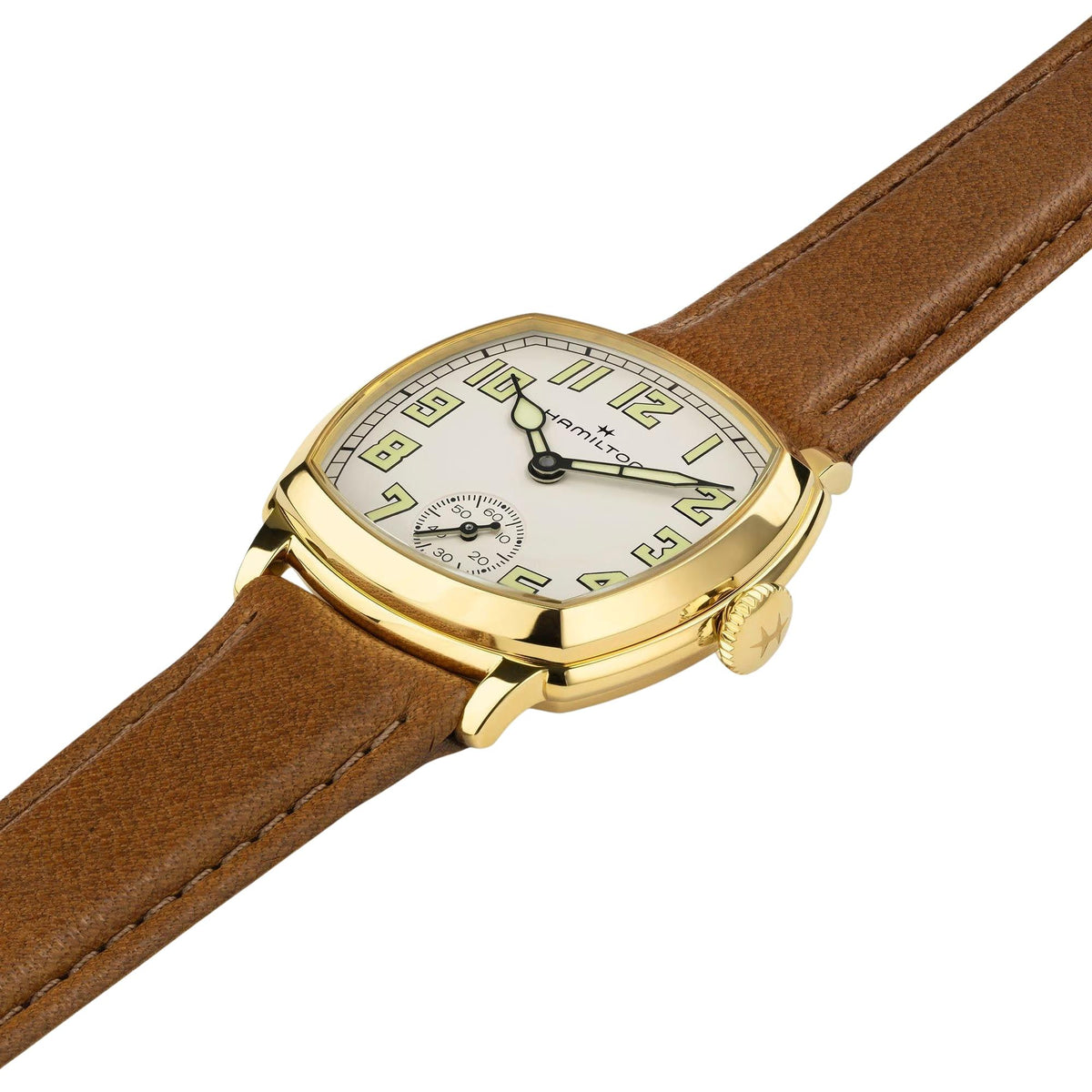 Hamilton American Classic Cushion Mechanical H36119520 angled display showing beige dial with yellow gold-tone steel case and leather strap