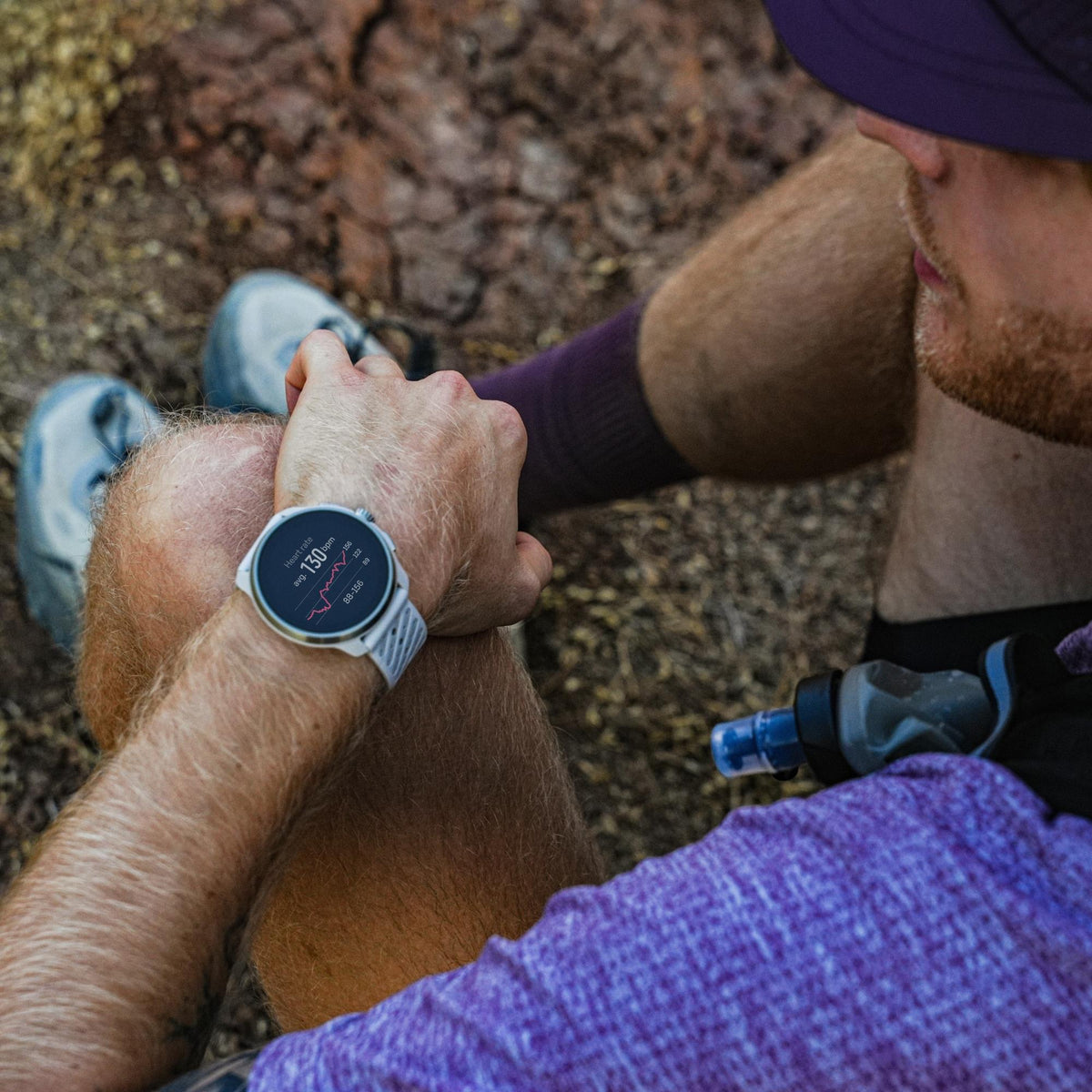 Suunto Race 3S SS051646000 lifestyle wrist shot displaying digital fitness screen worn during outdoor training