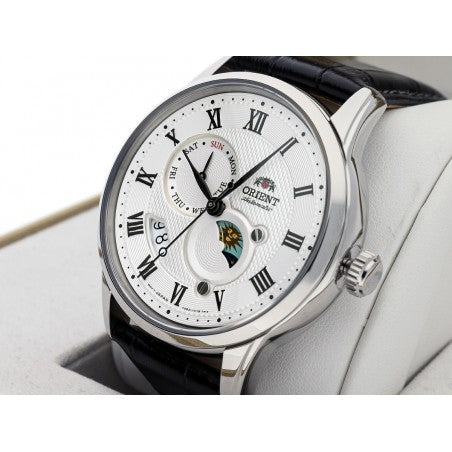 Men's automatic watch showing white dial and crown, Roman numerals, black leather strap
