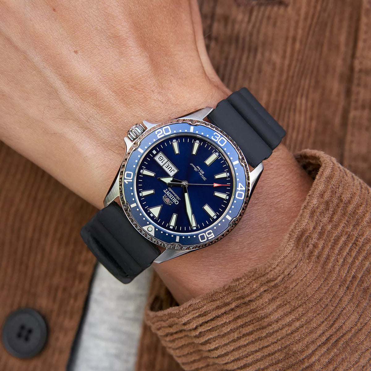 Orient Mako III RA-AA0006L19B blue dial on a wrist close-up showing day-date display