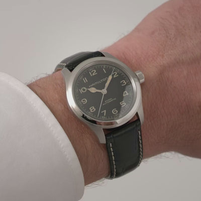 Hamilton Khaki Field Murph H70405730 mens automatic watch wrist shot displaying black dial and stainless steel case with white shirt sleeve